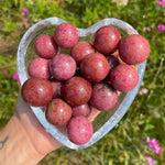 pink rhodonite crystal spheres carving